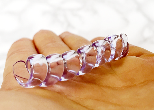 close of punyu spiral pencil grip in hand