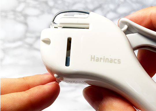 harinacs stapleless stapler being used, close up